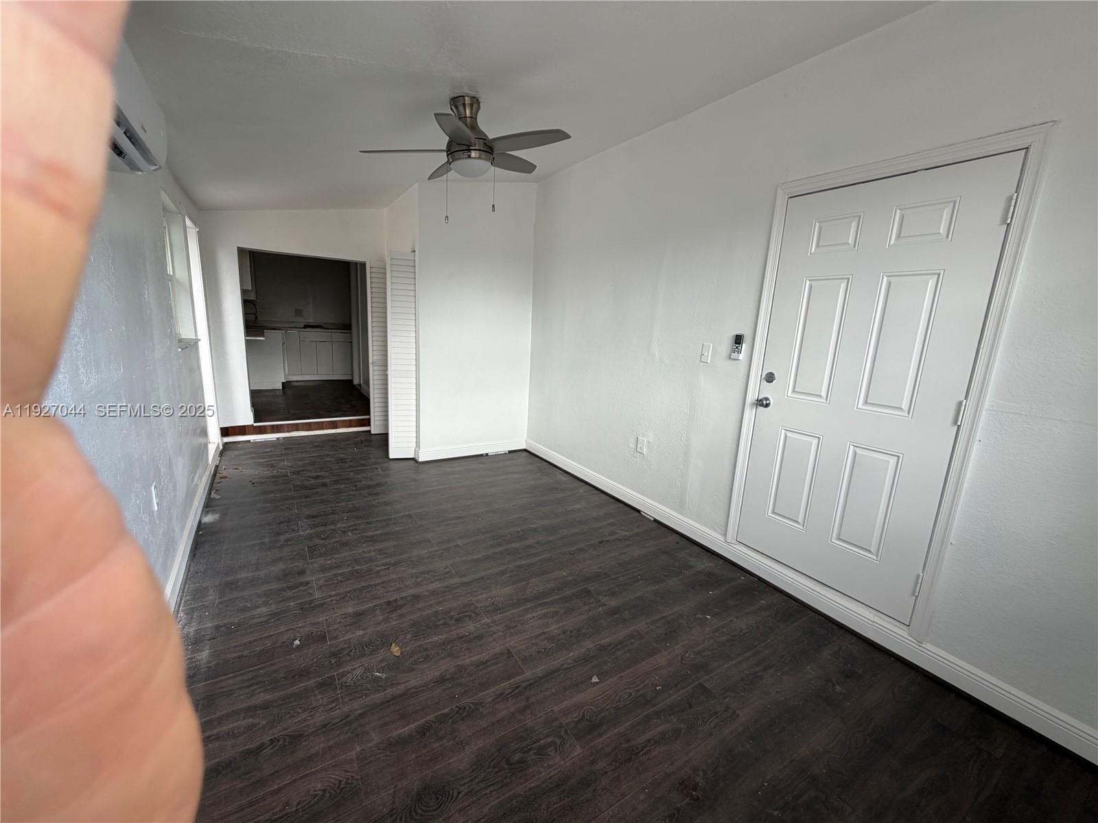 12455 Southwest 185th Terrace Miami, FL 33177 - Photo 6 of 18 wooden floor in an empty room