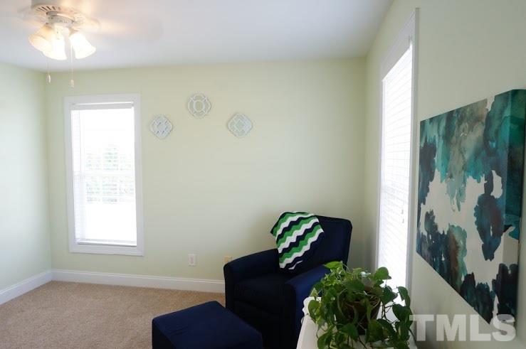 6972 Rock Ridge Sims Road Sims, NC 27880 - Photo 12 of 21 Front Right bedroom is spacious and windows add a lot of natural light.