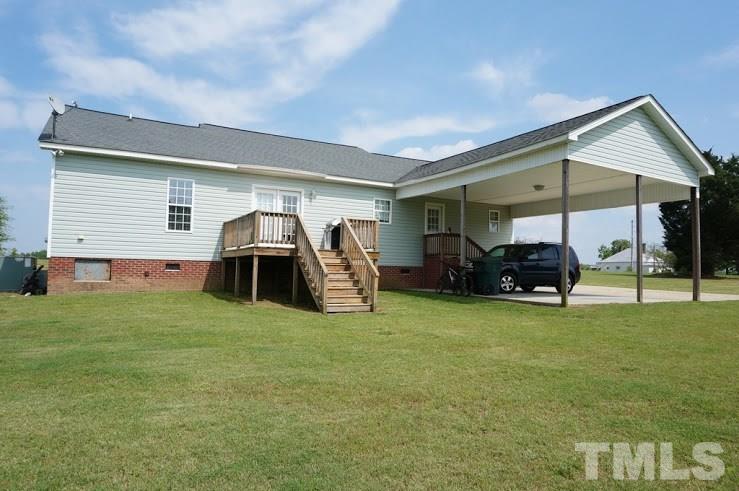 6972 Rock Ridge Sims Road Sims, NC 27880 - Photo 20 of 21 Large deck off of the Dining area over looking the large back yard.