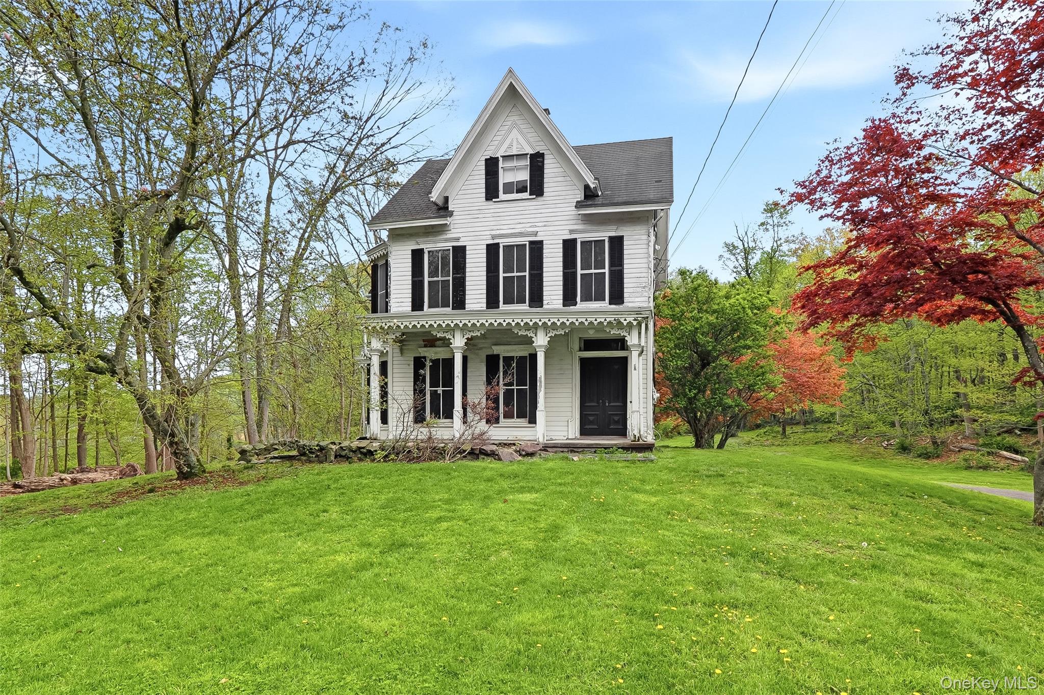 15 Ladentown Road Pomona, NY 10970 - Photo 1 of 23 a front view of a house with a garden