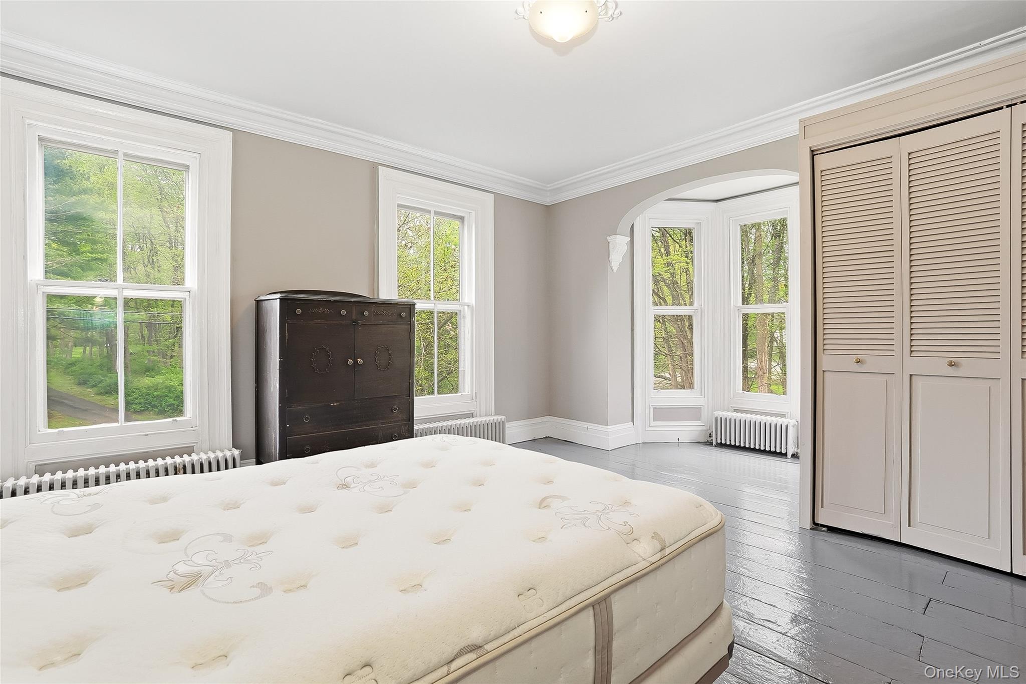 15 Ladentown Road Pomona, NY 10970 - Photo 15 of 23 a bedroom with a bed and a large window