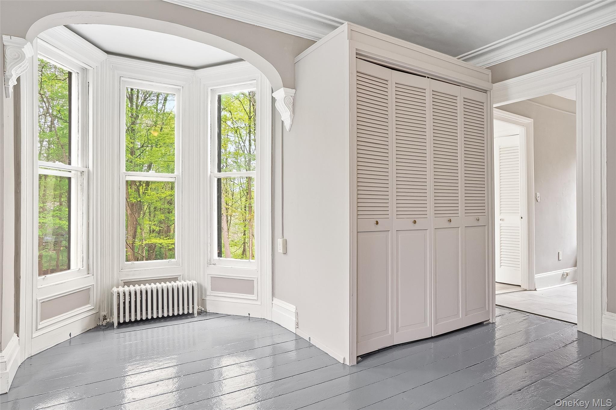 15 Ladentown Road Pomona, NY 10970 - Photo 16 of 23 a view of an empty room with a window and wooden floor