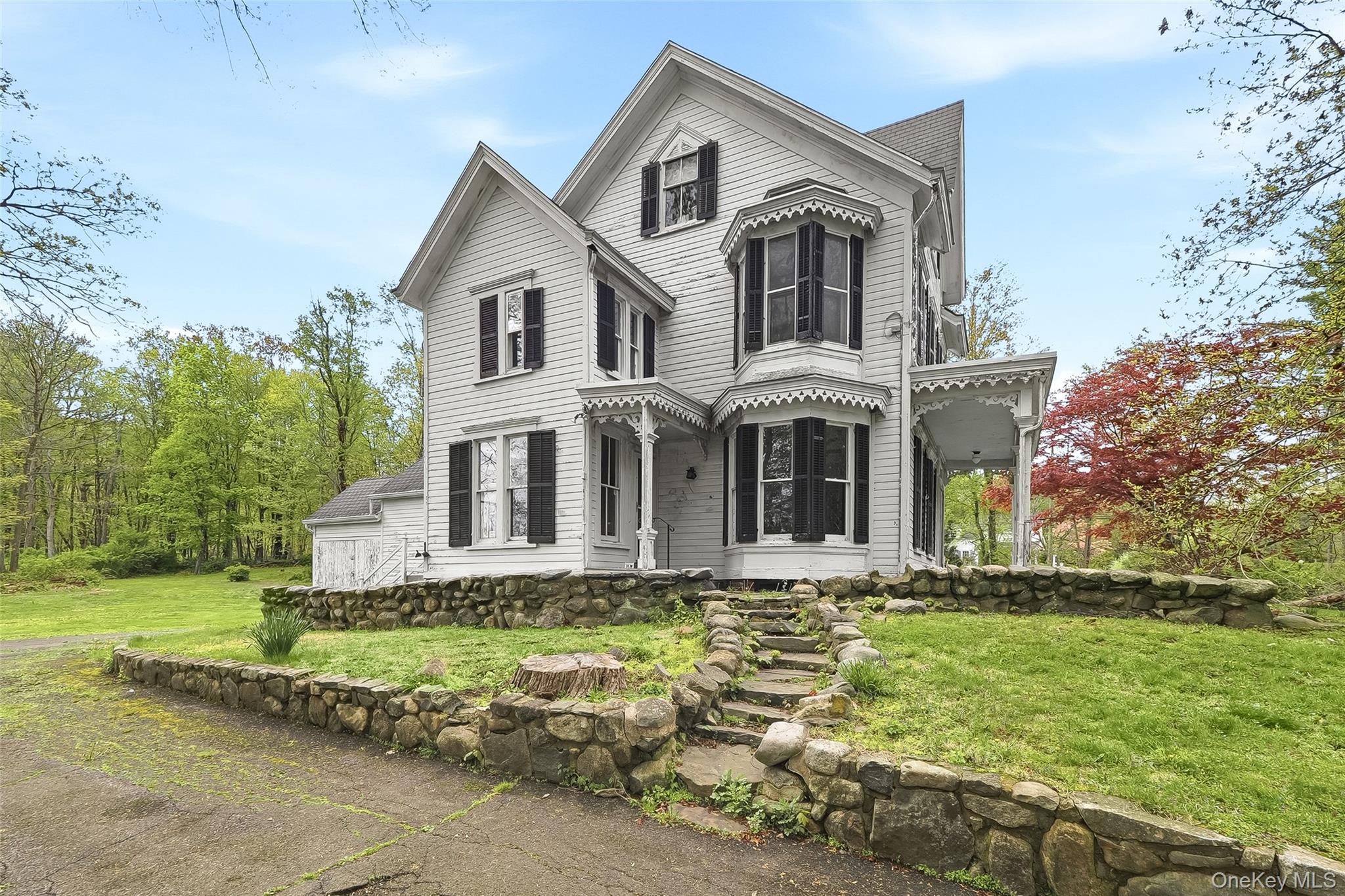 15 Ladentown Road Pomona, NY 10970 - Photo 2 of 23 a front view of a house with a yard