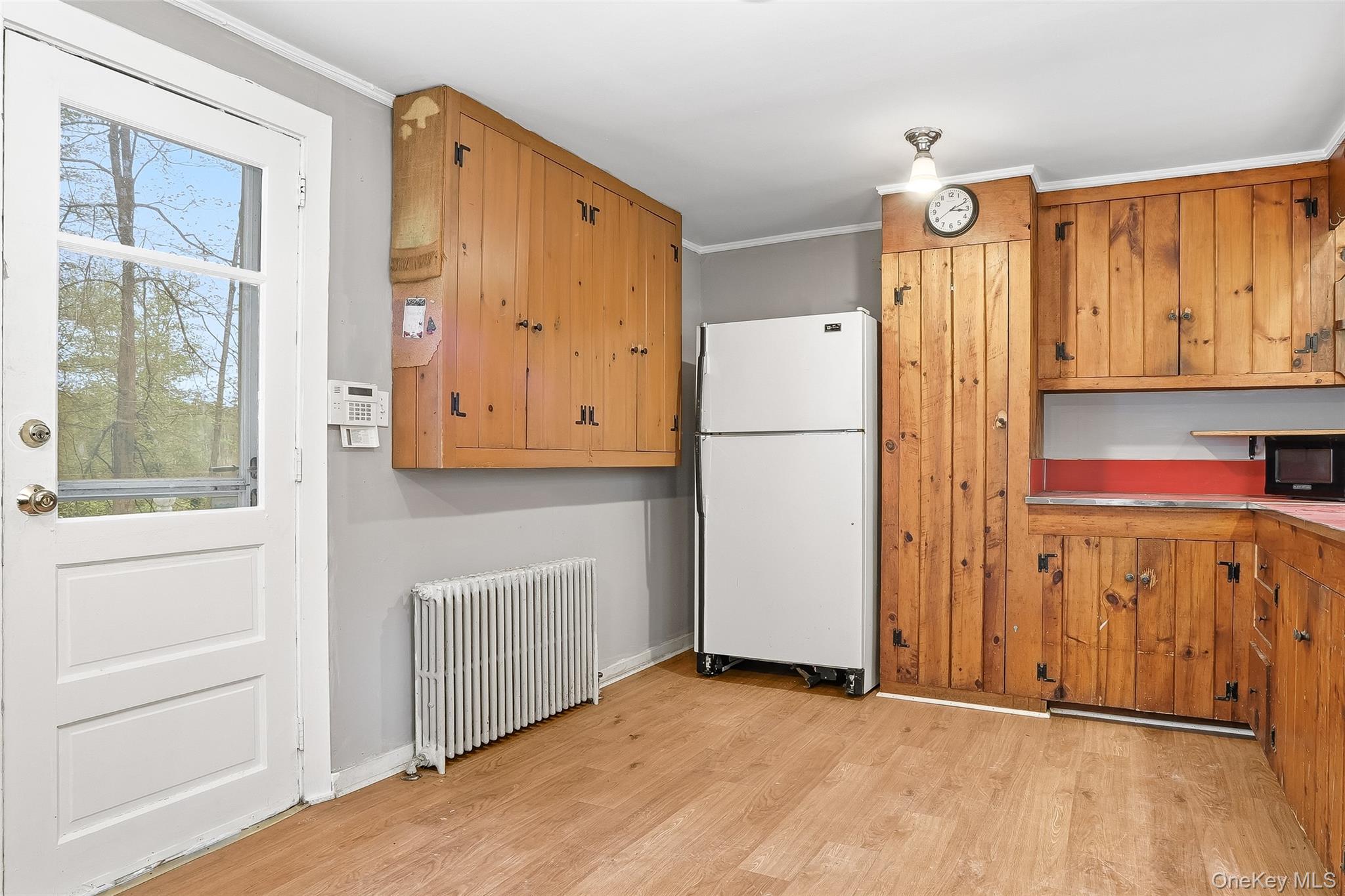 15 Ladentown Road Pomona, NY 10970 - Photo 9 of 23 a view of kitchen with wooden floor and electronic appliances
