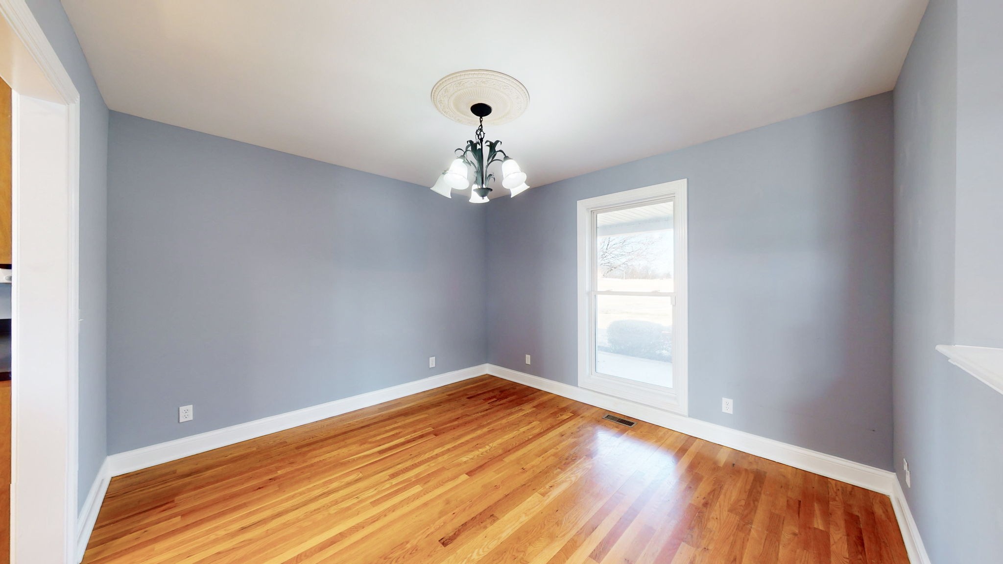 3086 South Rutland Road Mount Juliet, TN 37122 - Photo 13 of 69 a view of a room with wooden floor and chandelier