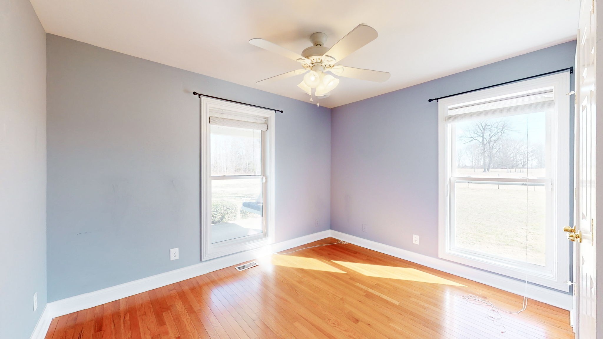 3086 South Rutland Road Mount Juliet, TN 37122 - Photo 18 of 69 a view of an empty room with wooden floor and a window