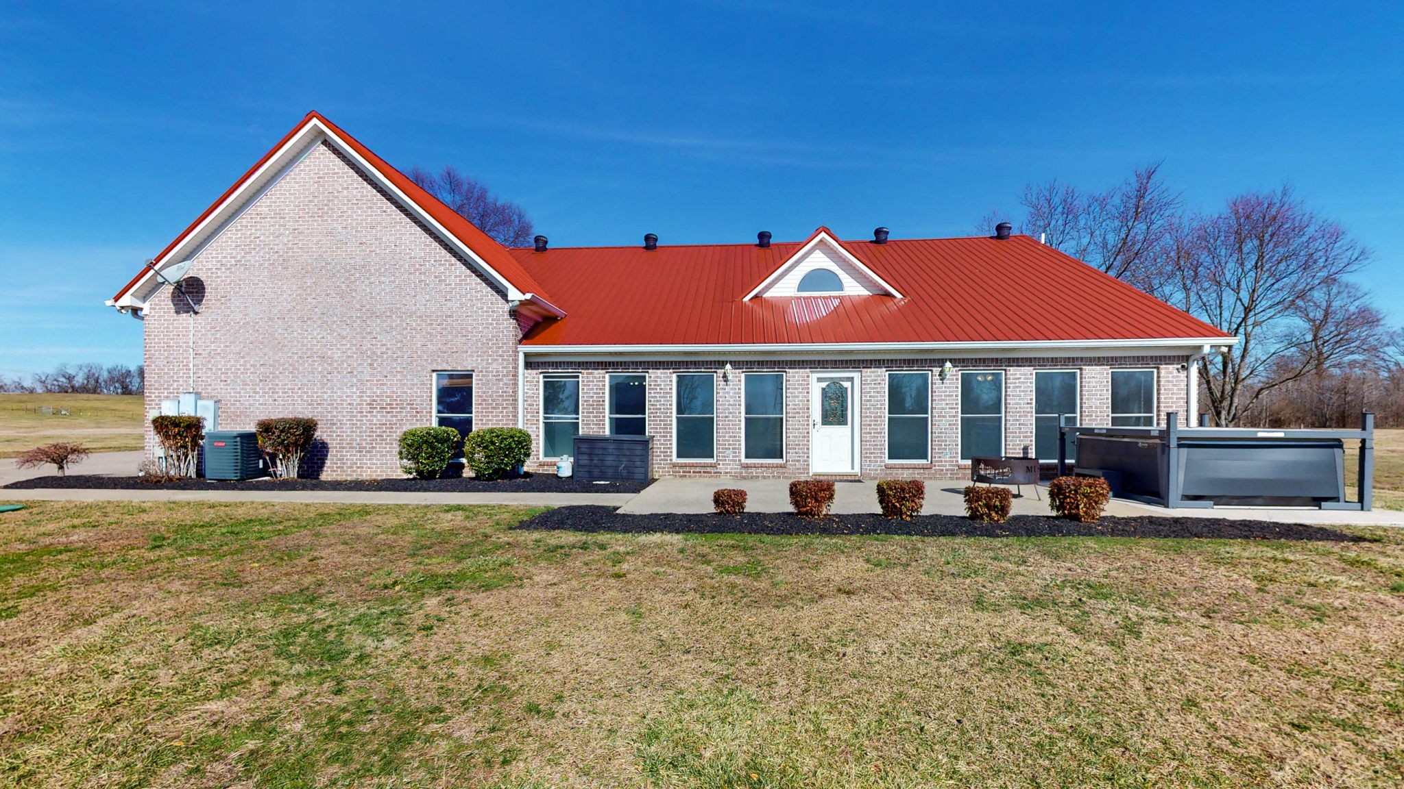 3086 South Rutland Road Mount Juliet, TN 37122 - Photo 2 of 69 a front view of a house with a yard table and chairs