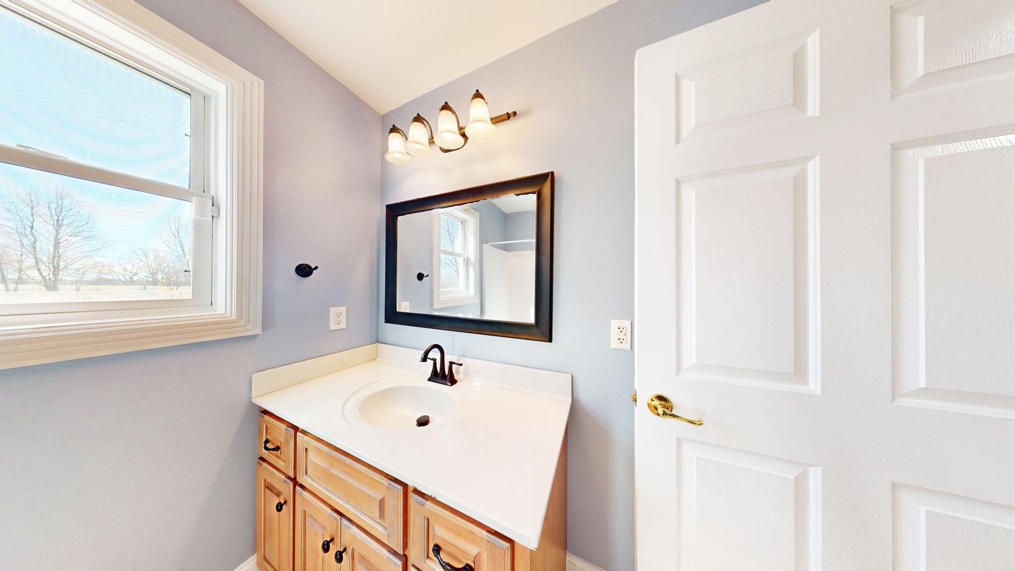 3086 South Rutland Road Mount Juliet, TN 37122 - Photo 21 of 69 a bathroom with a sink and a mirror