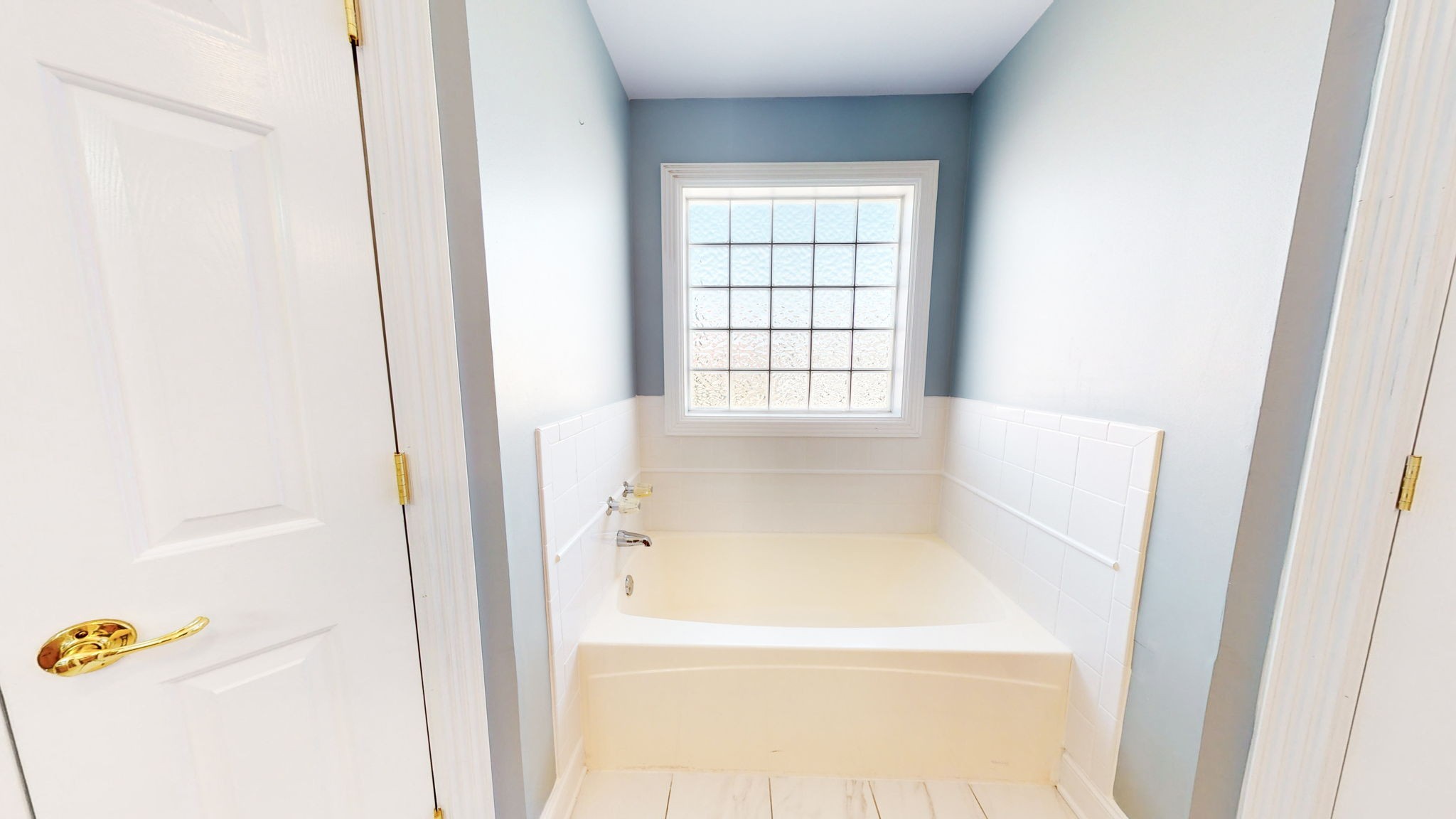 3086 South Rutland Road Mount Juliet, TN 37122 - Photo 32 of 69 a white bath tub sitting next to a window