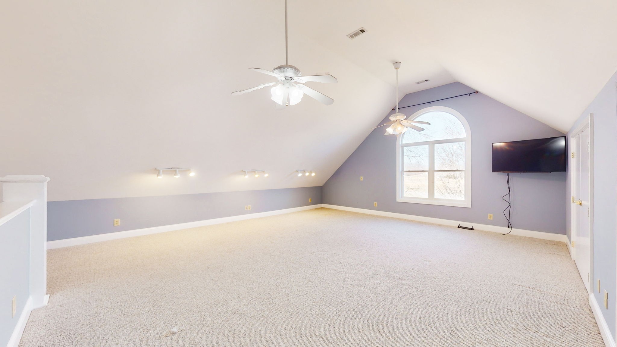 3086 South Rutland Road Mount Juliet, TN 37122 - Photo 36 of 69 an empty room with windows and ceiling fan