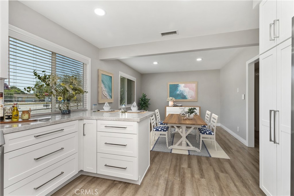 1837 North Studebaker Road Long Beach, CA 90815 - Photo 13 of 38 a kitchen with white cabinets and counter space