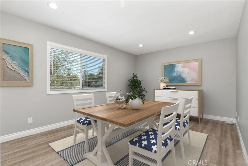 1837 North Studebaker Road Long Beach, CA 90815 - Photo 15 of 38 a view of a dining room with furniture and wooden floor
