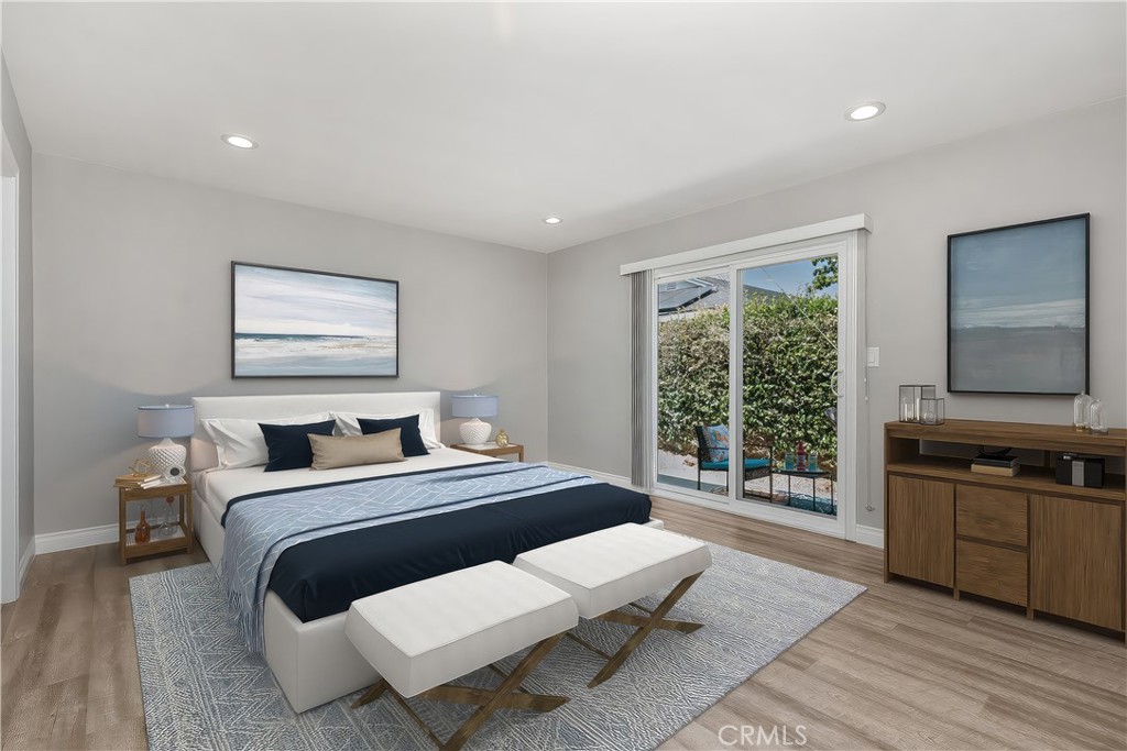 1837 North Studebaker Road Long Beach, CA 90815 - Photo 17 of 38 a bedroom with a bed and wooden floor