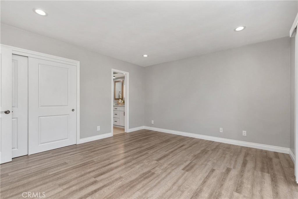 1837 North Studebaker Road Long Beach, CA 90815 - Photo 18 of 38 a view of an empty room with wooden floor