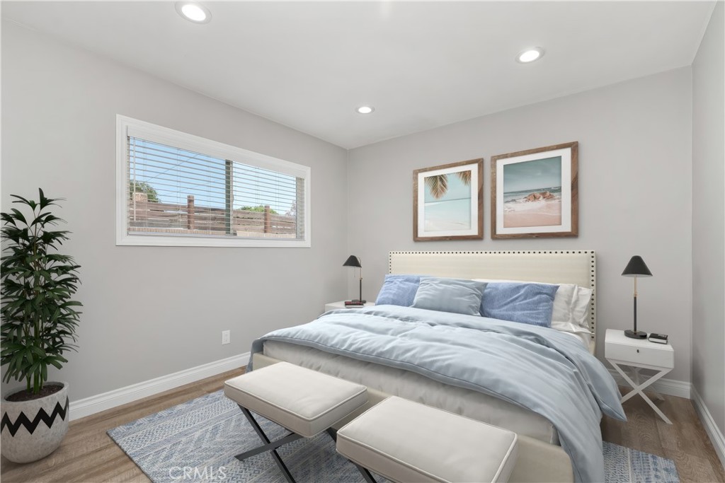 1837 North Studebaker Road Long Beach, CA 90815 - Photo 31 of 38 a bedroom with a bed and a potted plant