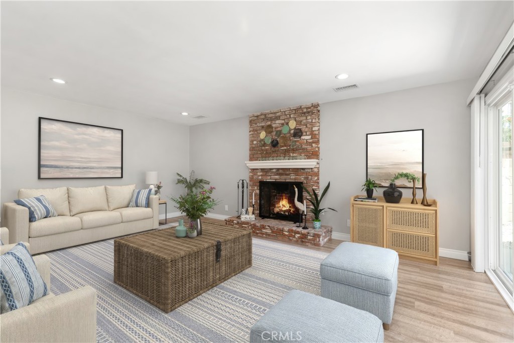 1837 North Studebaker Road Long Beach, CA 90815 - Photo 4 of 38 a living room with furniture and a fireplace