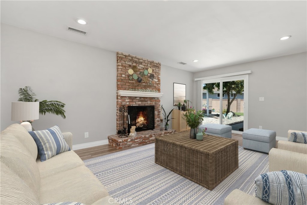 1837 North Studebaker Road Long Beach, CA 90815 - Photo 6 of 38 a living room with furniture and a fireplace