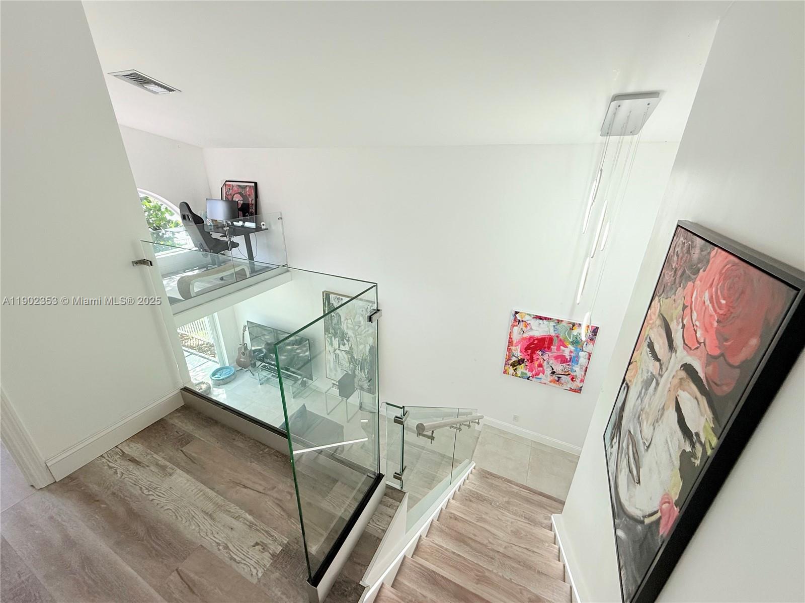 10626 Northwest 7th Street, Unit 10626 Pembroke Pines, FL 33026 - Photo 11 of 51 a view of a room with shelves and wooden floor