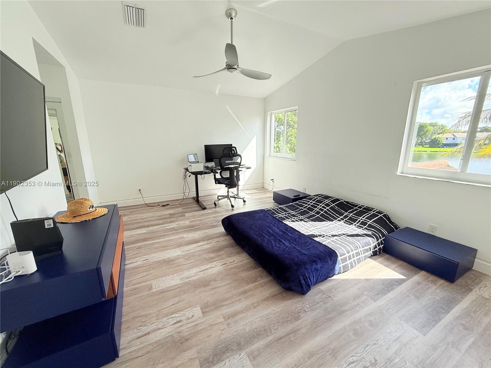 10626 Northwest 7th Street, Unit 10626 Pembroke Pines, FL 33026 - Photo 17 of 51 a living room with furniture and a flat screen tv