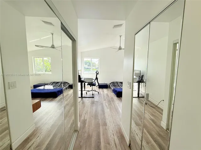 a view of a livingroom with furniture and a flat screen tv