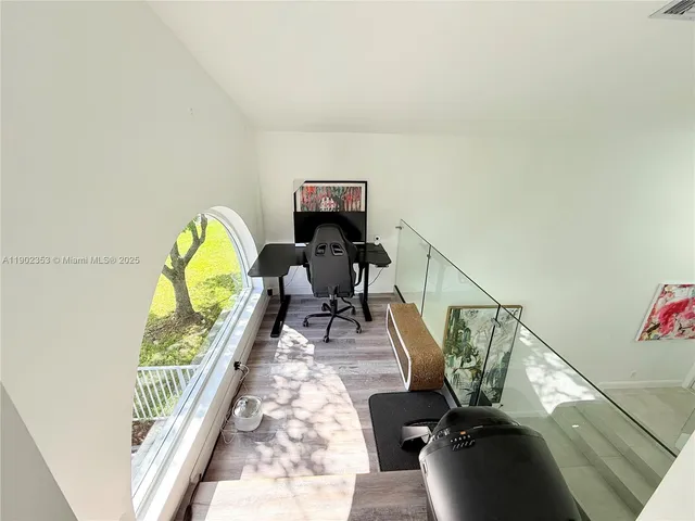 a spacious bathroom with a double vanity sink mirror and bathtub