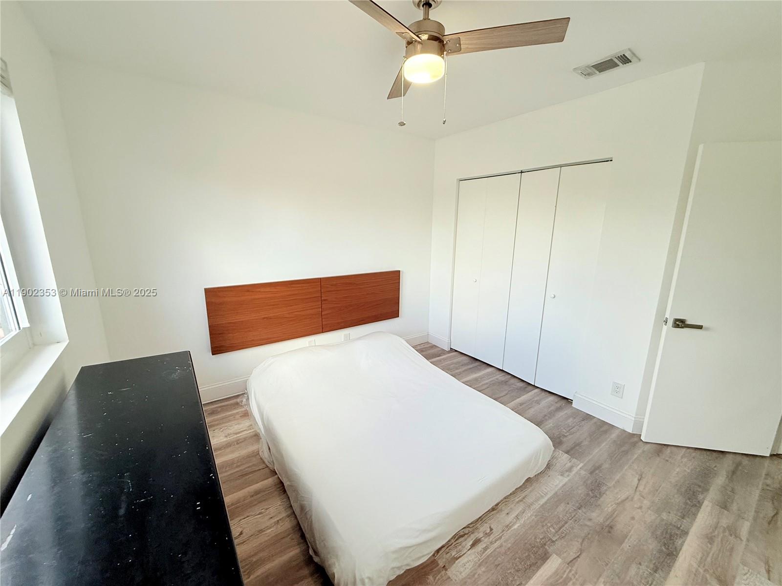 10626 Northwest 7th Street, Unit 10626 Pembroke Pines, FL 33026 - Photo 26 of 51 a view of a bedroom with wooden floor