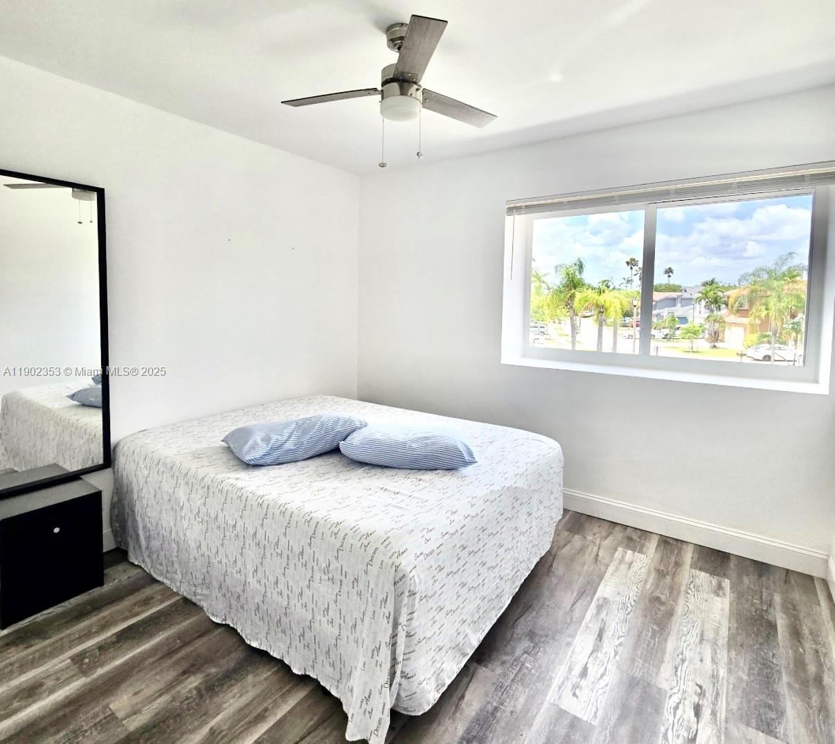 10626 Northwest 7th Street, Unit 10626 Pembroke Pines, FL 33026 - Photo 33 of 51 a bedroom with a bed and window