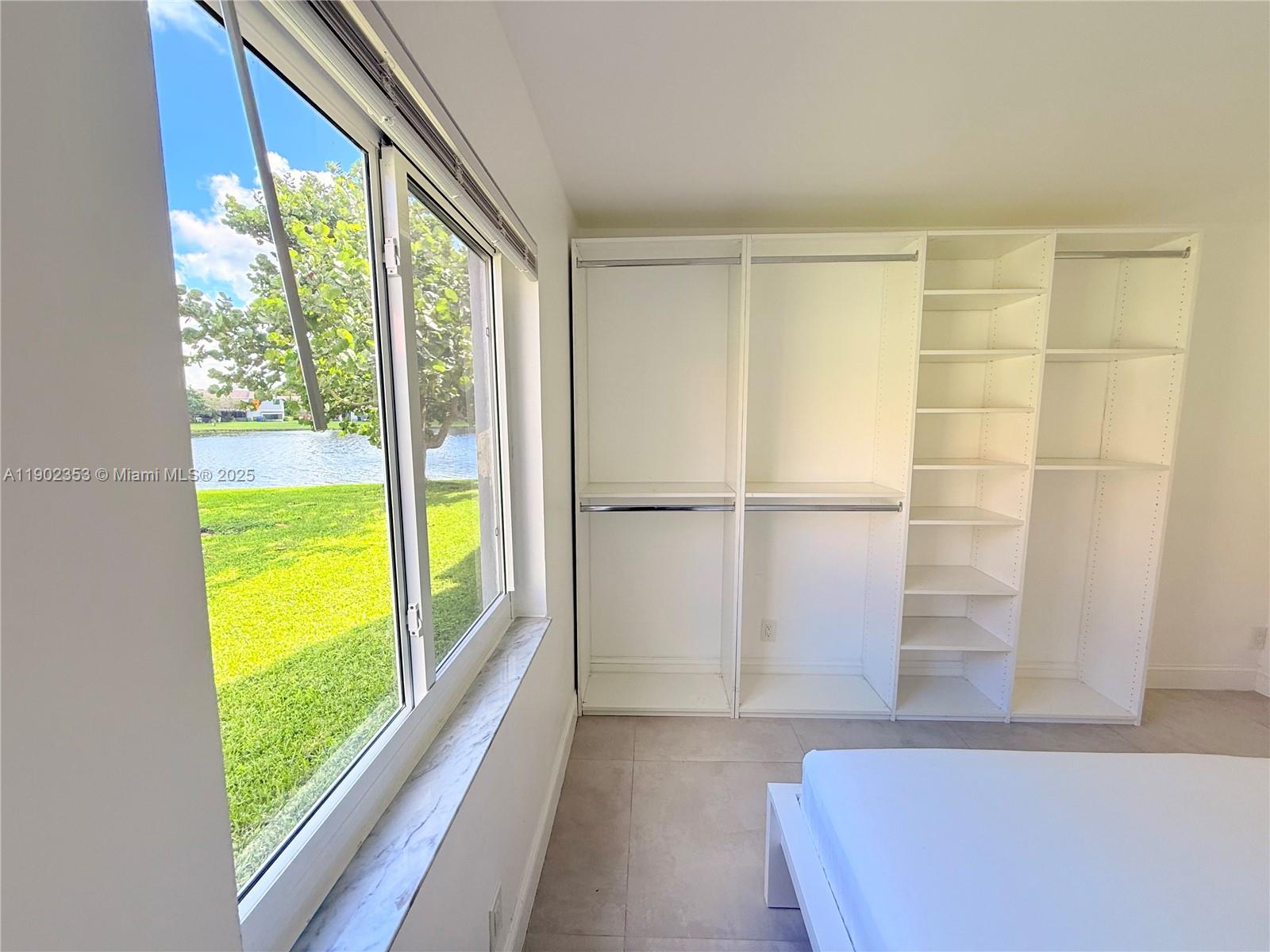 10626 Northwest 7th Street, Unit 10626 Pembroke Pines, FL 33026 - Photo 34 of 51 a view of a room with window