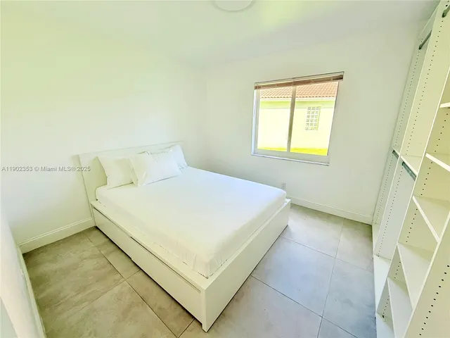 a bathroom with a sink mirror and toilet
