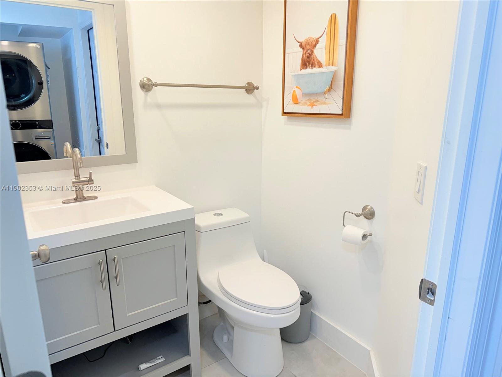 10626 Northwest 7th Street, Unit 10626 Pembroke Pines, FL 33026 - Photo 40 of 51 a white toilet sitting next to a bathroom sink