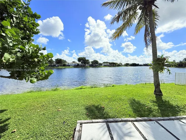 a view of a lake with a yard