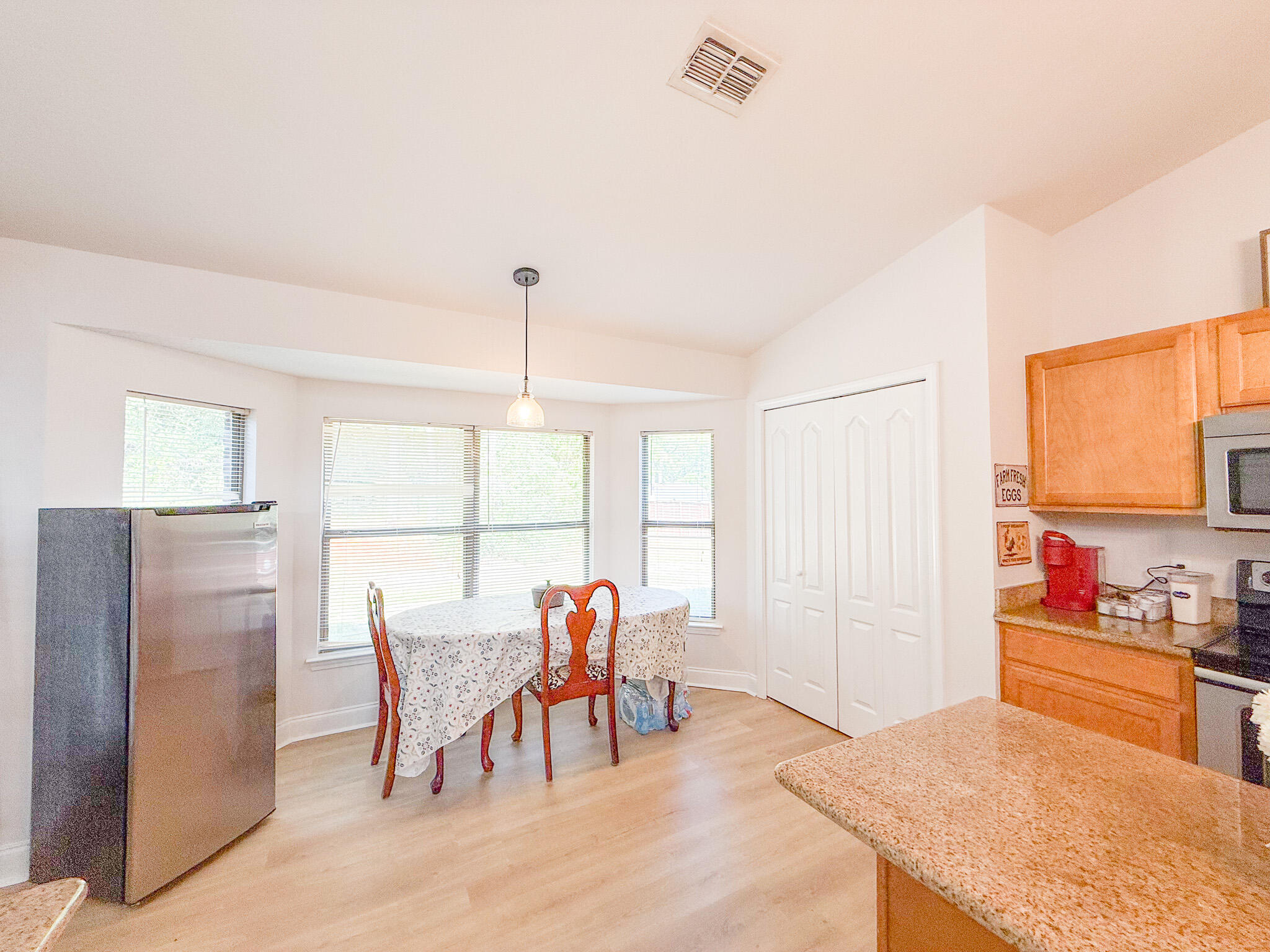 6214 Flash Lane Crestview, FL 32536 - Photo 11 of 42 a view of a dining room with furniture
