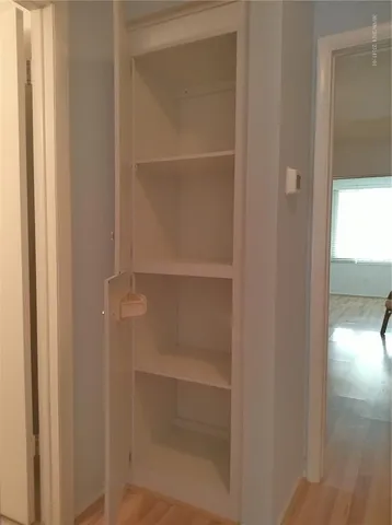 a bedroom with a bed and a table