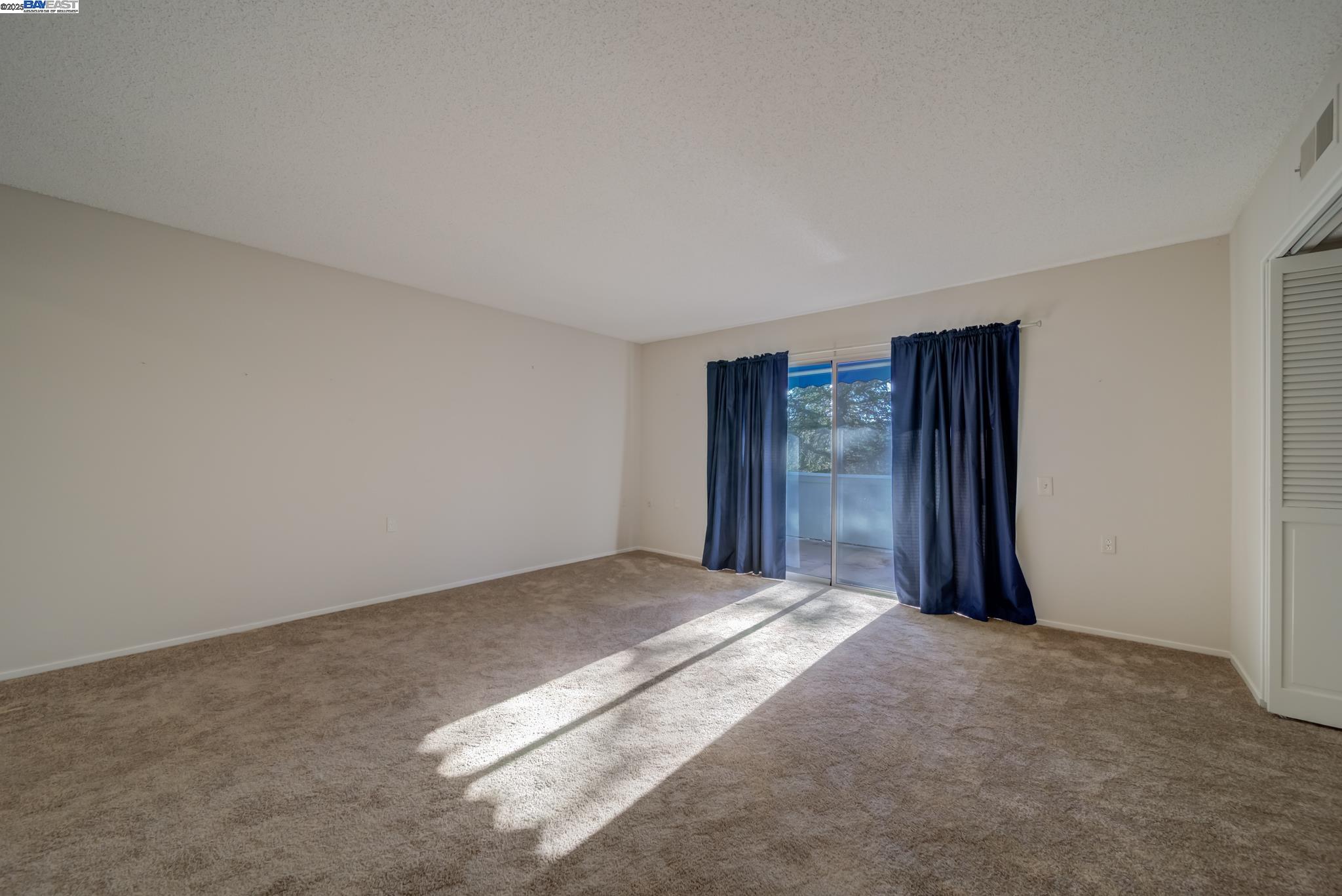 1708 Golden Rain Road, Unit 3 Walnut Creek, CA 94595 - Photo 12 of 23 a view of an empty room with closet and entryway