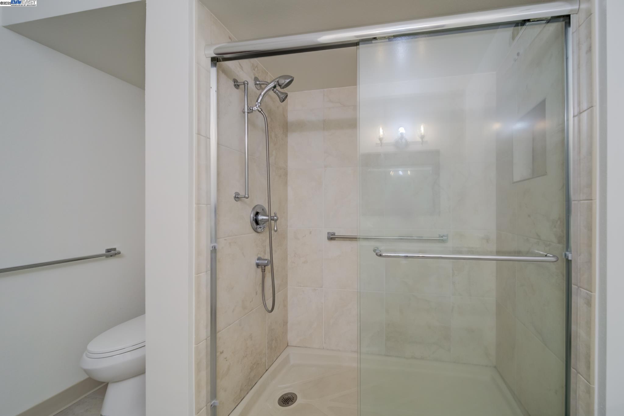 1708 Golden Rain Road, Unit 3 Walnut Creek, CA 94595 - Photo 21 of 23 a bathroom with a shower and a toilet