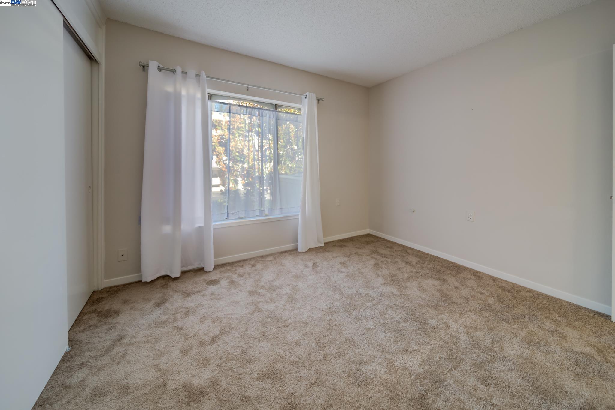 1708 Golden Rain Road, Unit 3 Walnut Creek, CA 94595 - Photo 23 of 23 an empty room with a window