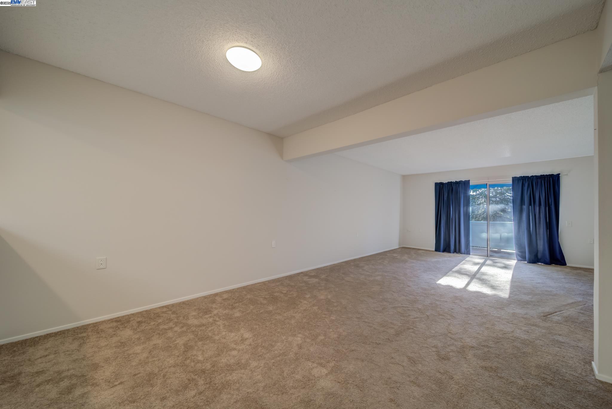 1708 Golden Rain Road, Unit 3 Walnut Creek, CA 94595 - Photo 7 of 23 a view of an empty room and window
