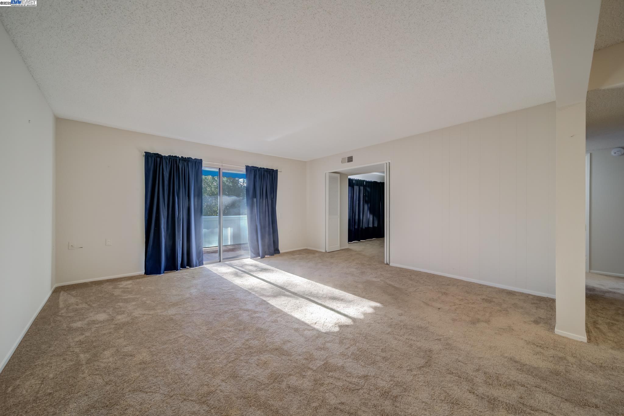 1708 Golden Rain Road, Unit 3 Walnut Creek, CA 94595 - Photo 9 of 23 a view of an empty room with closet and windows