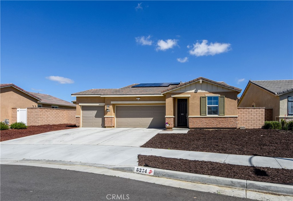 5274 Saloon Street Hemet, CA 92545 - Photo 1 of 1 a front view of a house with yard
