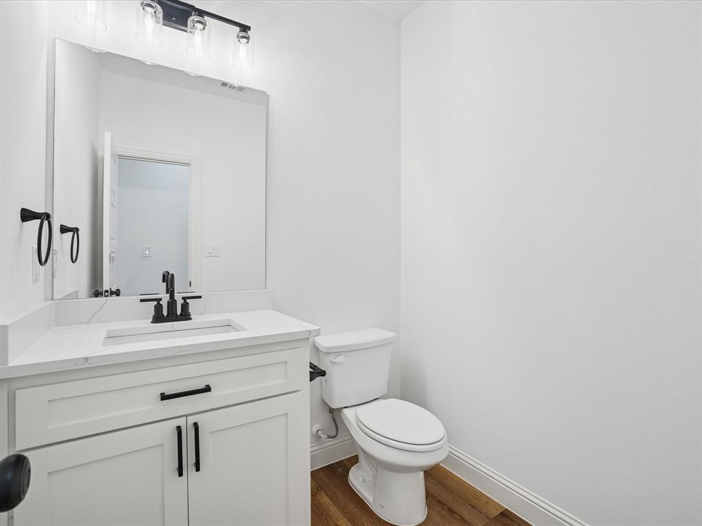 448 Rs County Road Alba, TX 75410 - Photo 11 of 29 a bathroom with a sink mirror vanity and toilet