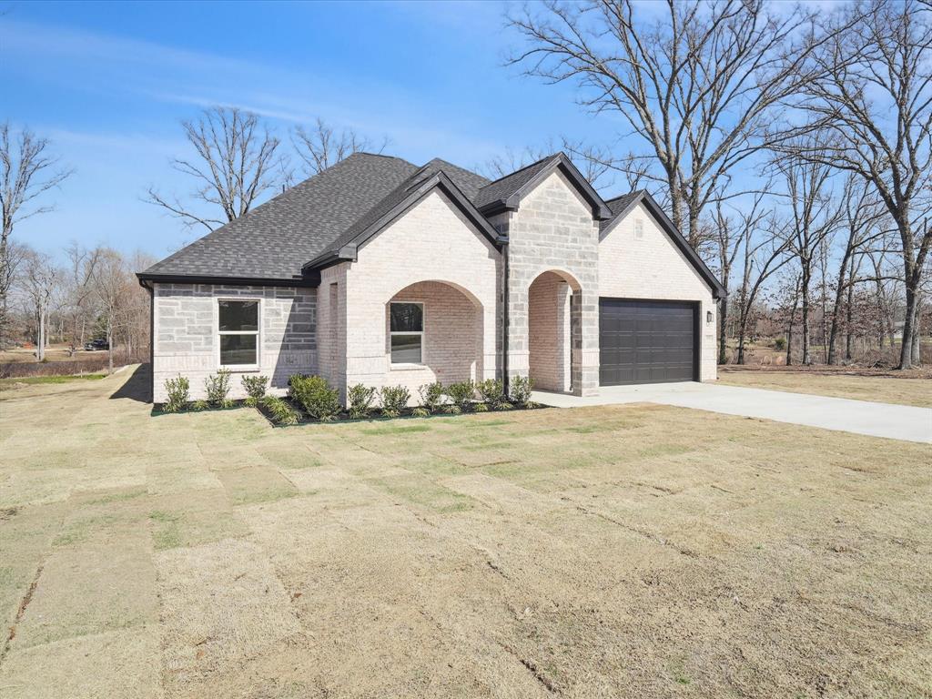 448 Rs County Road Alba, TX 75410 - Photo 2 of 29 a view of a house with a yard and large tree
