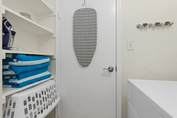 a bathroom with a window and a shower