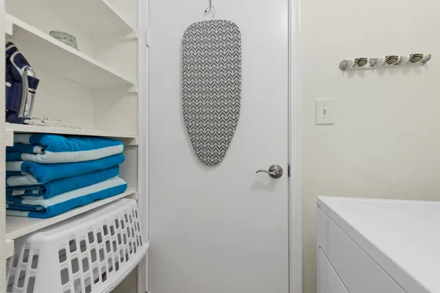 a bathroom with a window and a shower