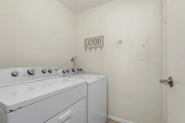 a utility room with dryer and washer
