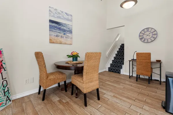 a view of a livingroom with furniture and wooden floor
