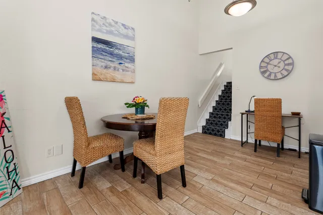 a view of a livingroom with furniture and wooden floor