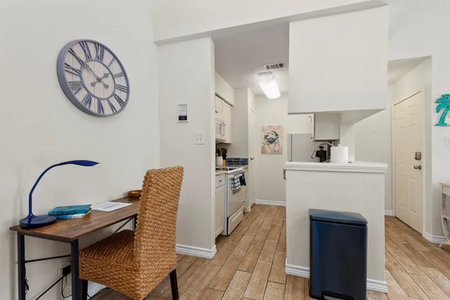 a kitchen with furniture and a fireplace