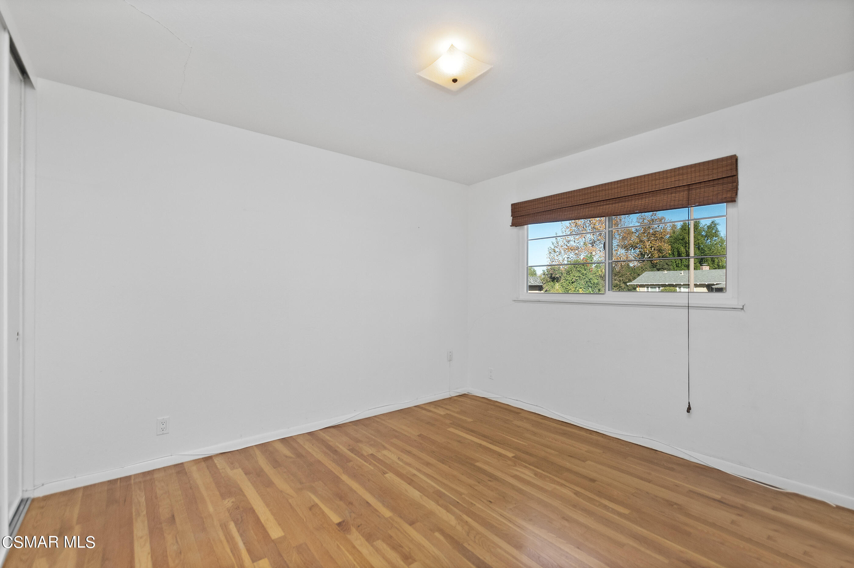 2772 Harrington Road Simi Valley, CA 93065 - Photo 15 of 36 a view of empty room with wooden floor and fan