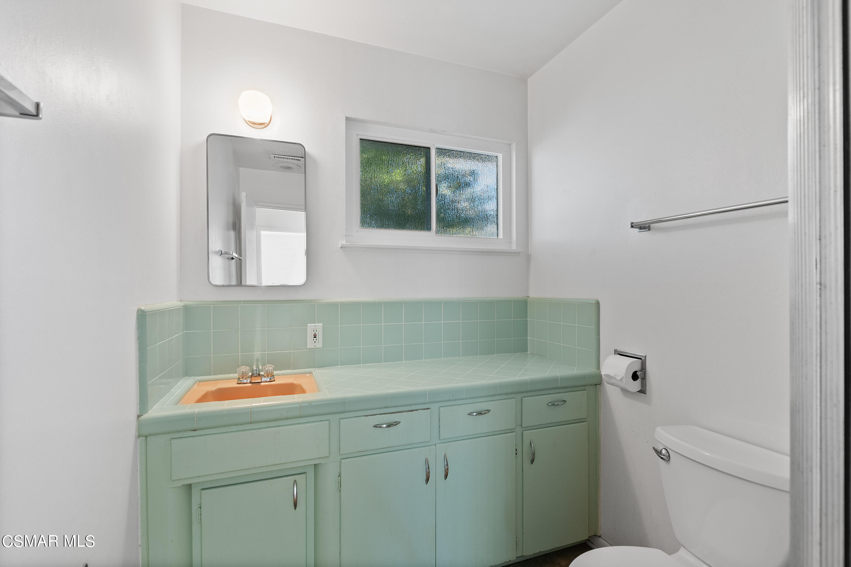 2772 Harrington Road Simi Valley, CA 93065 - Photo 16 of 36 a bathroom with a sink and a mirror