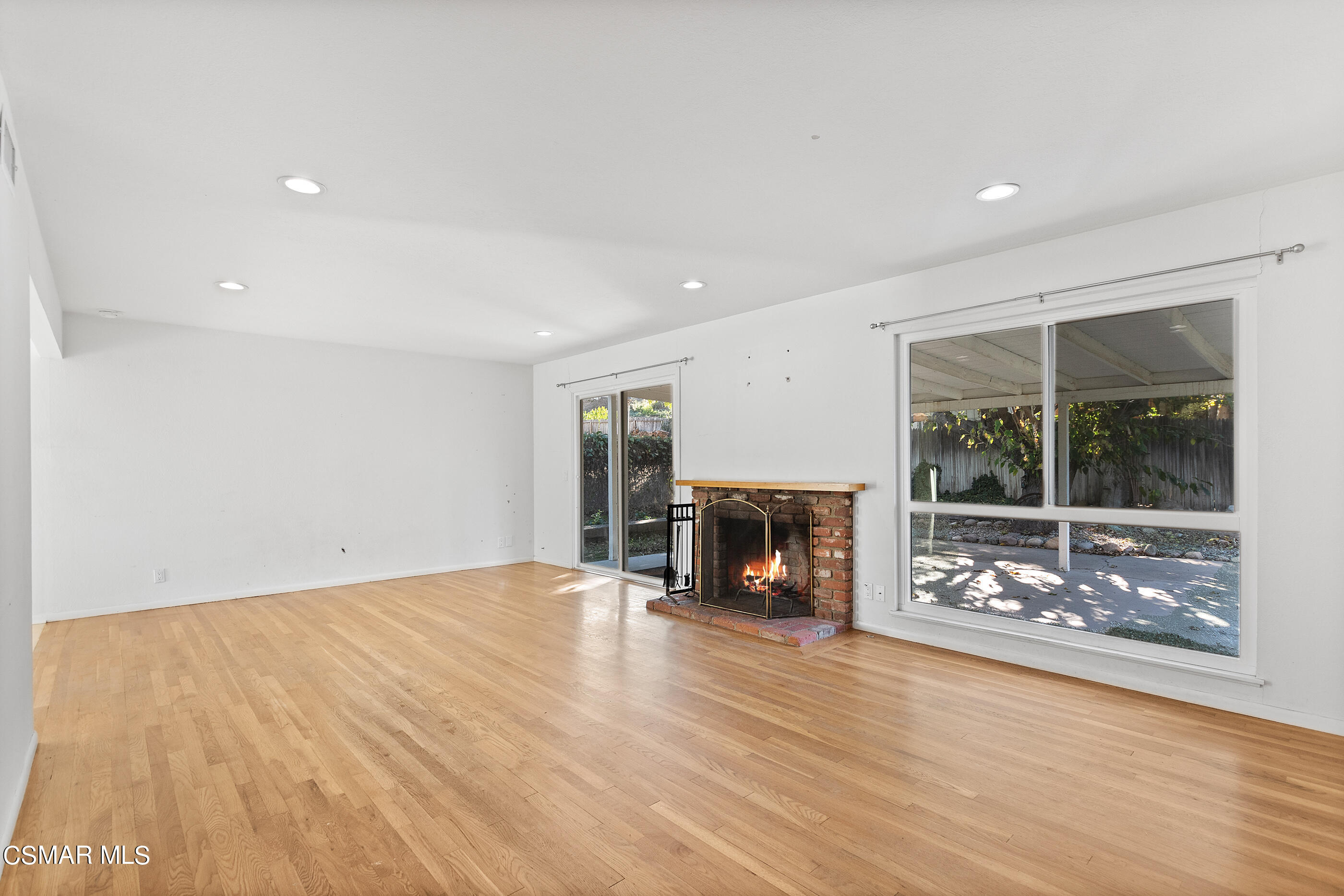 2772 Harrington Road Simi Valley, CA 93065 - Photo 4 of 36 a view of an empty room with fire place and a window